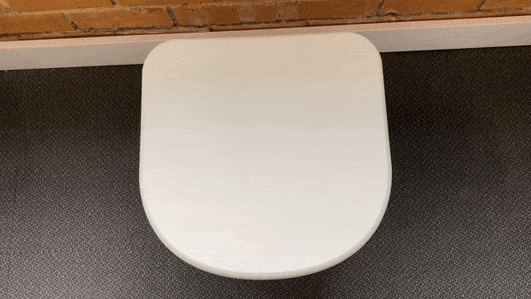 White lid of the Joolca toilet, seen from above