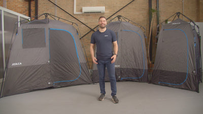 Presenter among the ENSUITE Single, Double and Triple shower tents in a studio